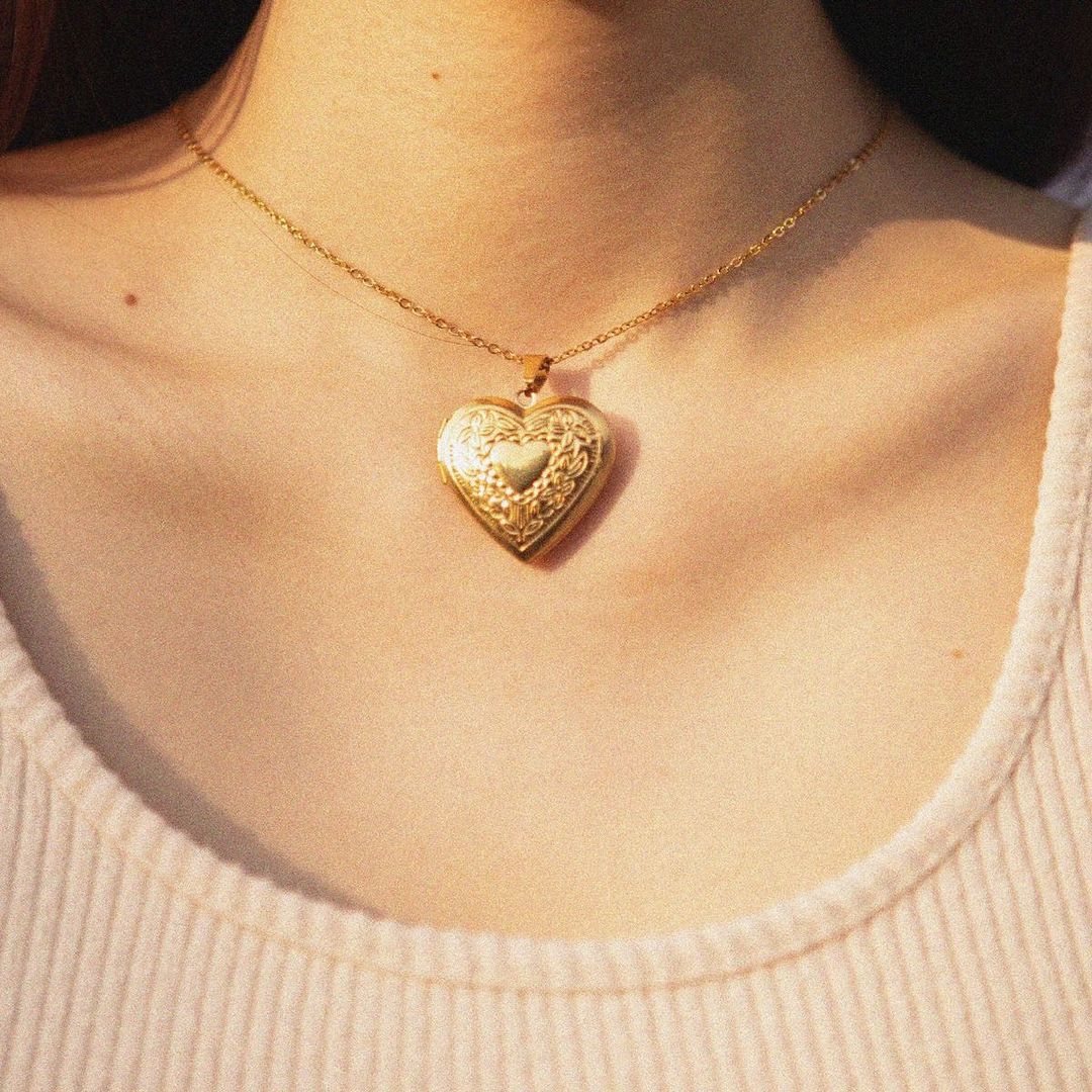 gold heart necklace with photo inside