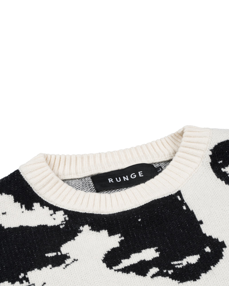 Long sleeves 'Faces' knitwear in cream white. Faces
design knitted allover. Crewneck collar. Rib-knit
cuffs and hem.
