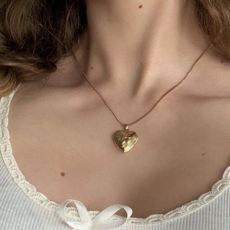 gold heart necklace with photo inside