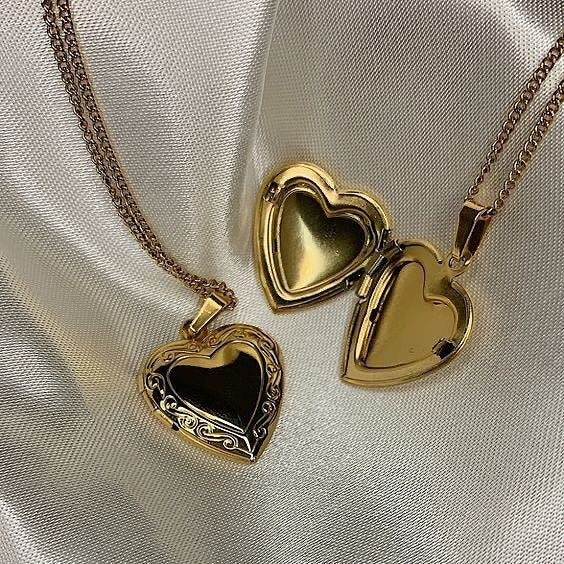 ‏gold heart necklace with photo inside