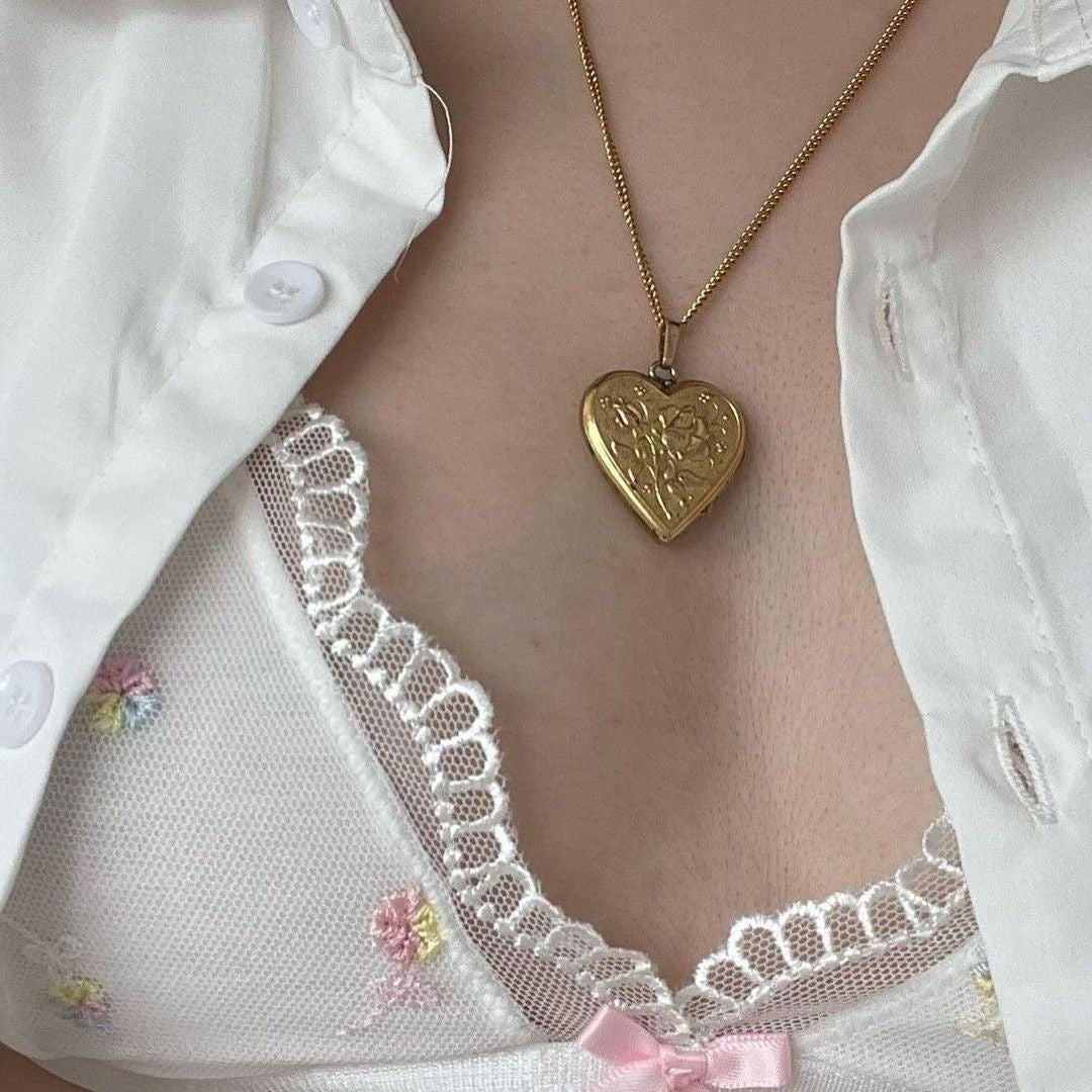 ‏gold heart necklace with photo inside