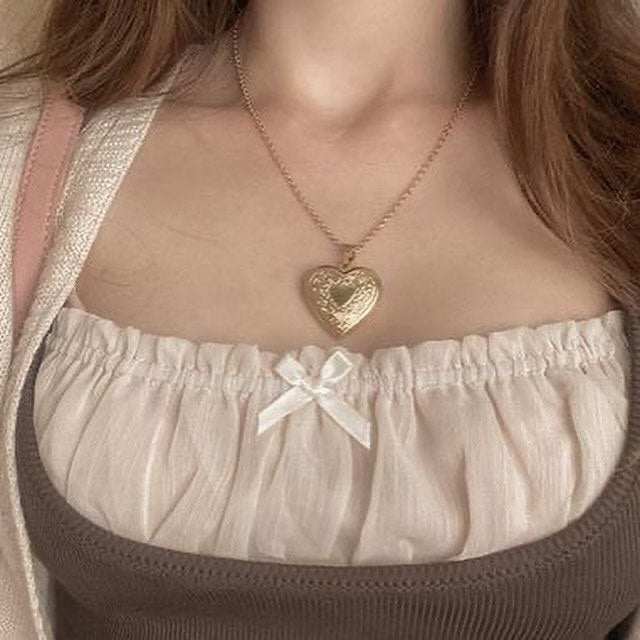 ‏gold heart necklace with photo inside