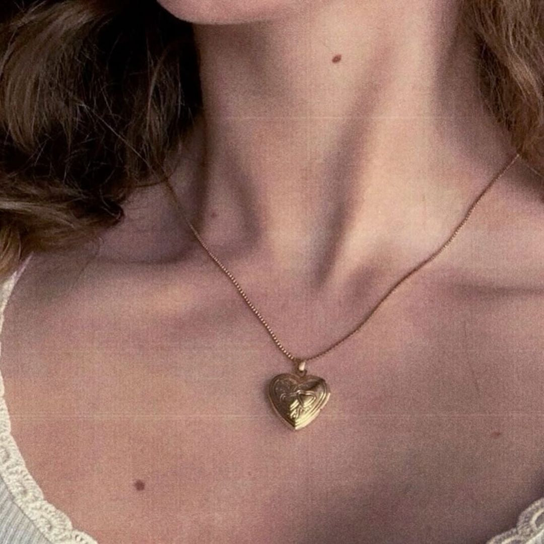 ‏gold heart necklace with photo inside