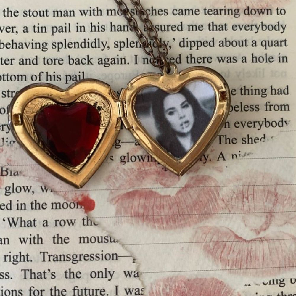 ‏gold heart necklace with photo inside