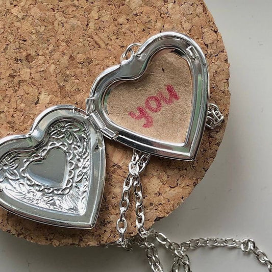 ‏silver heart necklace with photo inside